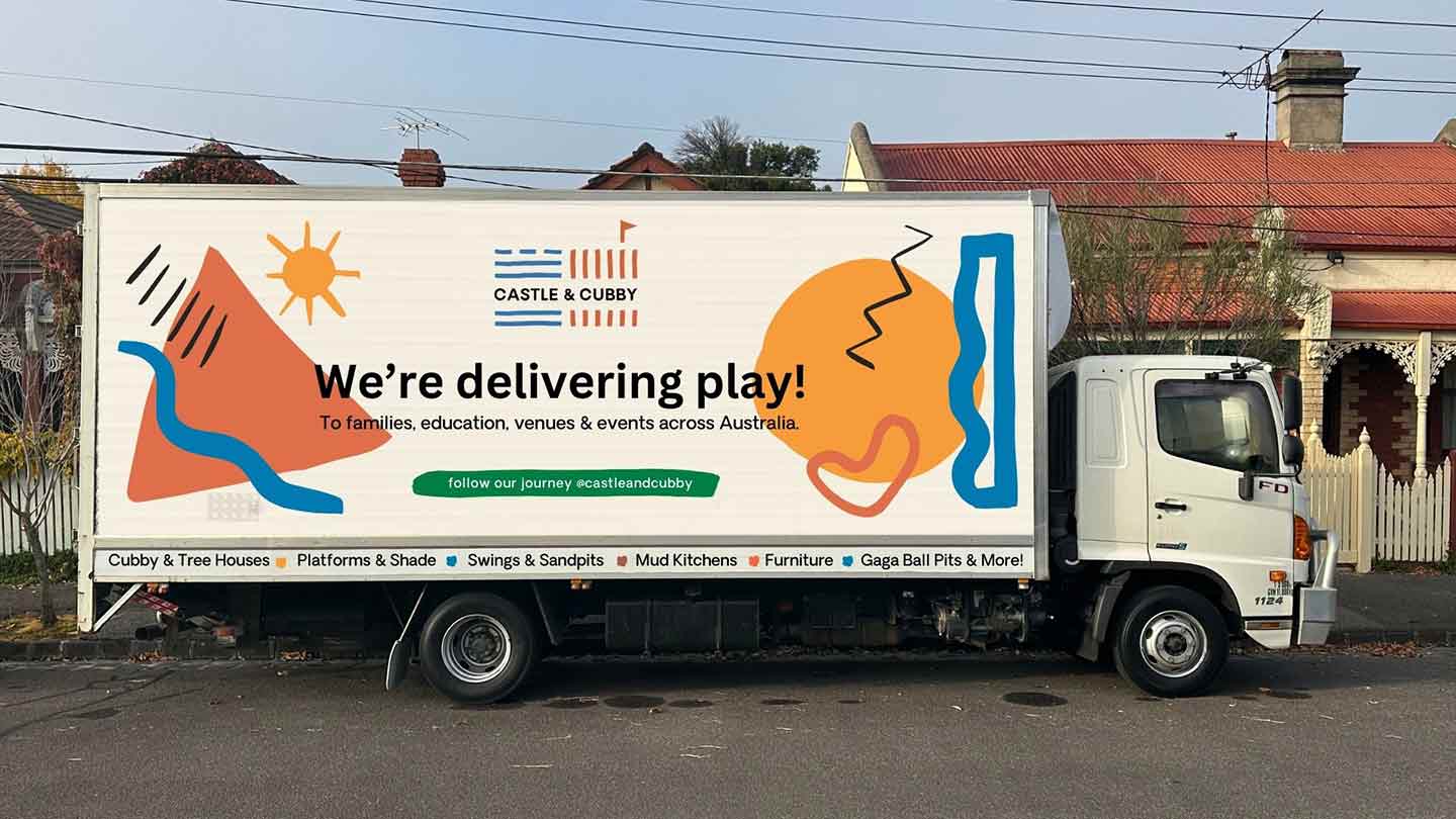 The Castle & Cubby delivery truck - with a bright and colourful logo on the side that says We're delivering Play.