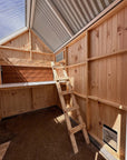 Bespoke Pine interior of a large barn style chicken coop with clear roof panels