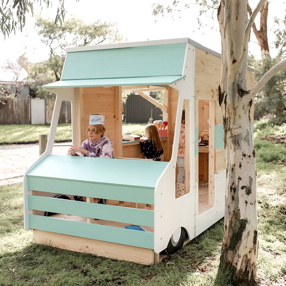 The front view of a painted wooden foodtruck cubby house