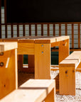 Detail shot of a Timber outdoor table and bench seat for education, set under a shade structure