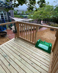 The view from the top of a raised wooden platform with ladder and slide