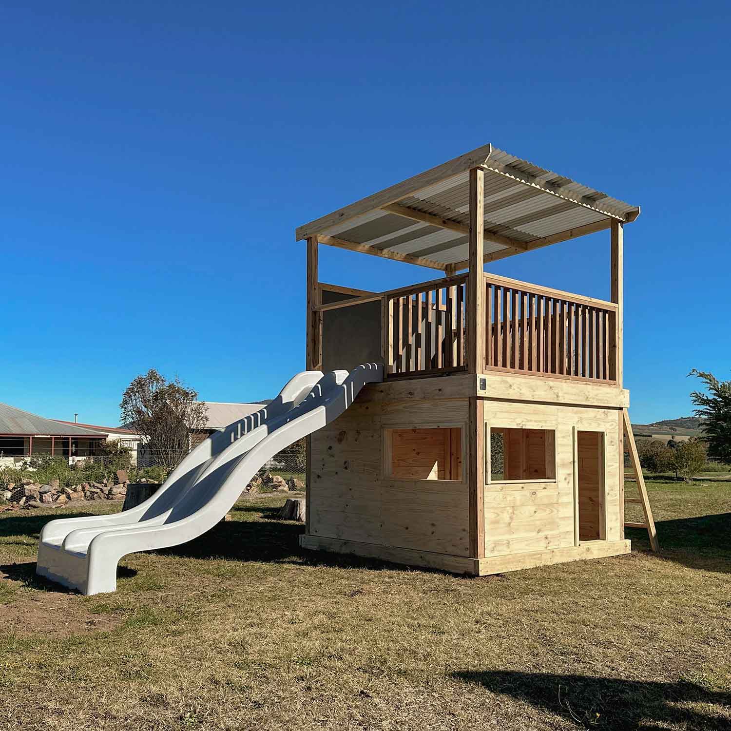 Timber Raised Platform Cubby House with Slide - For Primary Schools & Early Learning Centres - Hand Built in Australia by Castle & Cubby. 
