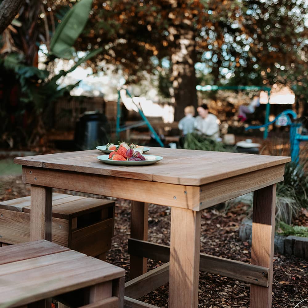 Fruit snacks on an outdoor wooden kids table