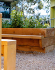 Raised timber garden bed with seating detail shot in landscaped outdoor classroom