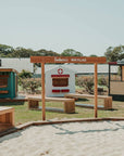 A mini village welcome entry sign in a school cubby play space