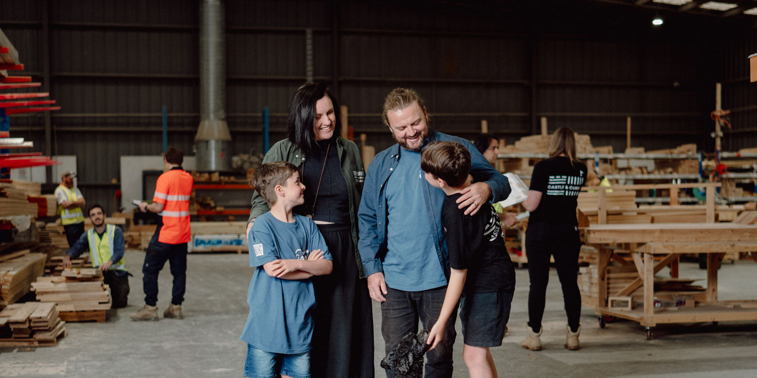 A picture of Castle & Cubby owners Kellie & Jonathan Stones with their children at their Workshop in Bayswater Victoria