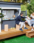 family having time at a cubby house