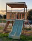 Raised platform cubby house with ladder and slides