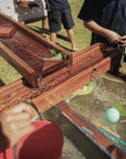Kids Timber Outdoor Water Wall. Designed for teaching kids about cause and effect, motion, maths and other play-based learning skills, while having a bit of fun at the same time.