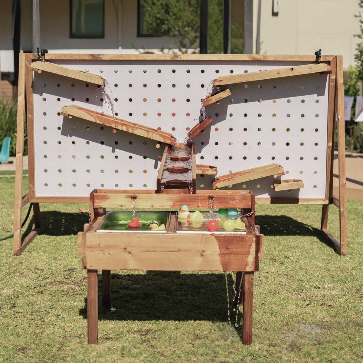 Kids Timber Outdoor Water Wall. Designed for teaching kids about cause and effect, motion, maths and other play-based learning skills, while having a bit of fun at the same time.