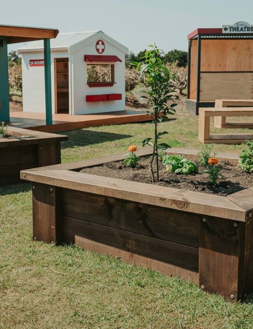 Timber Raised Garden Bed Kits - a built raised garden bed with herbs veggies. For gardeners who want to create stylish gardens 
