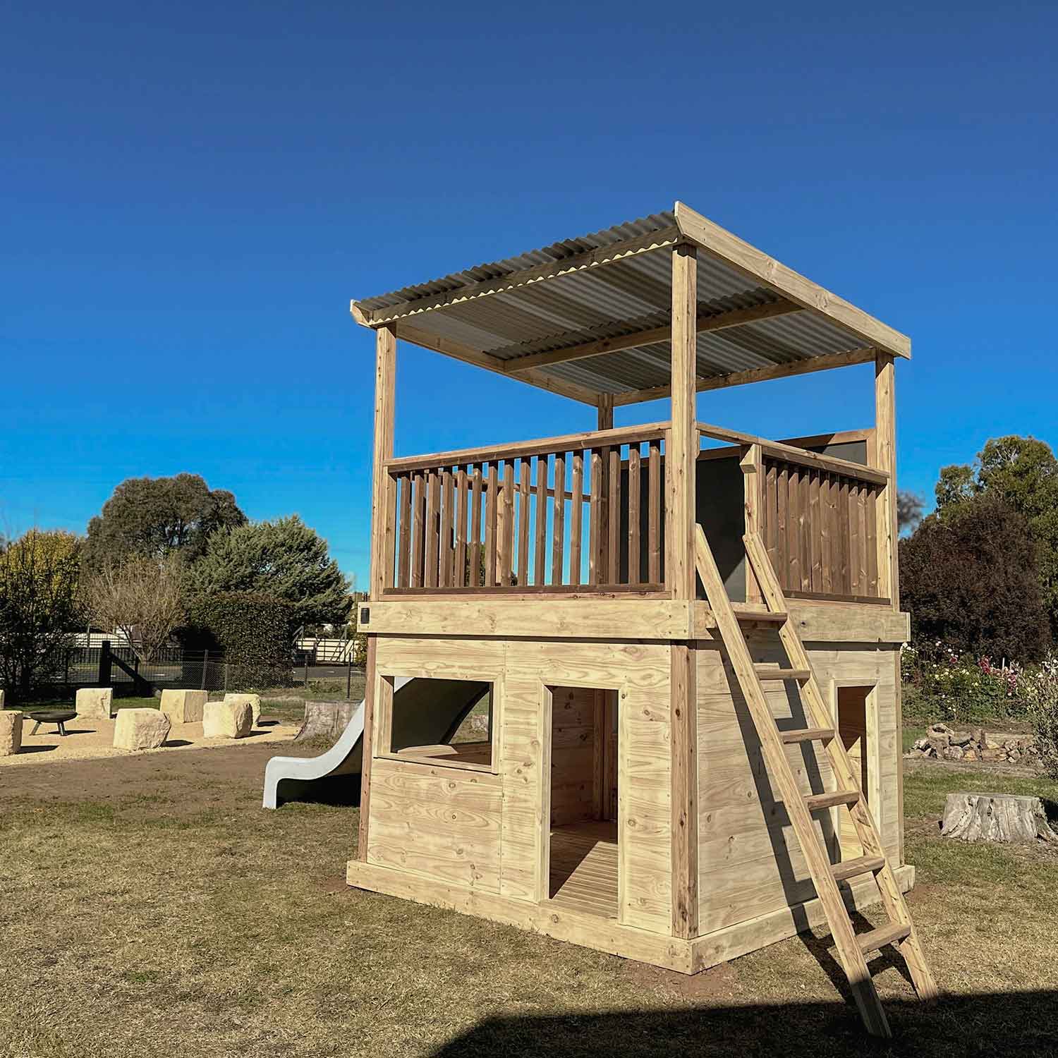 Timber Raised Platform Cubby House with Slide - For Primary Schools & Early Learning Centres - Hand Built in Australia by Castle & Cubby.