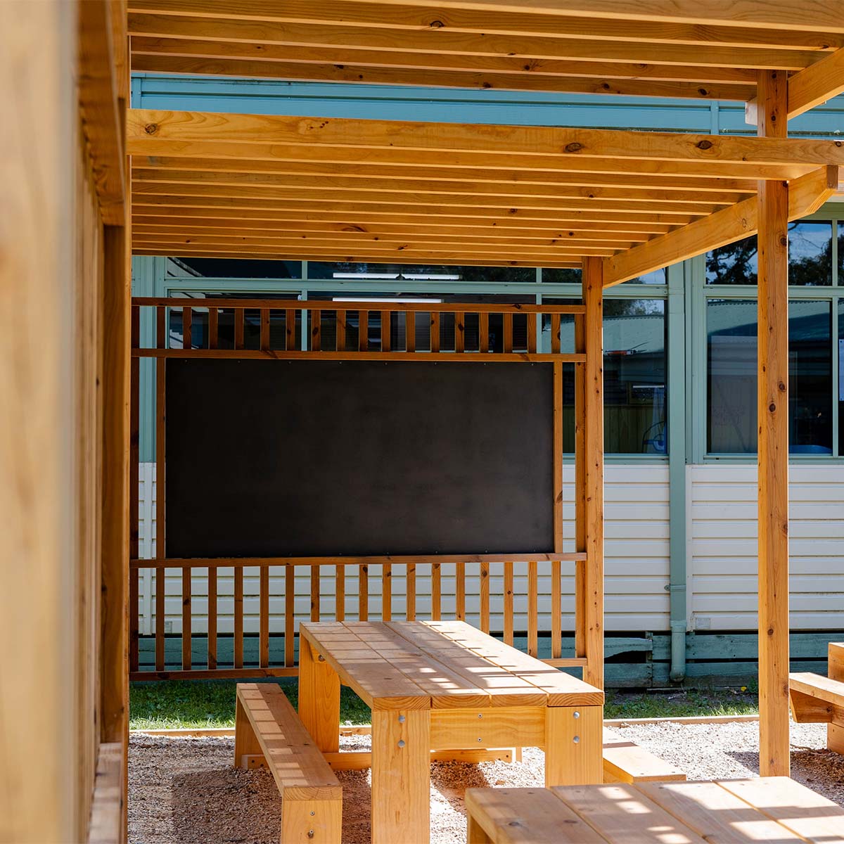 Timber pergola with a large blackboard for an outdoor classroom