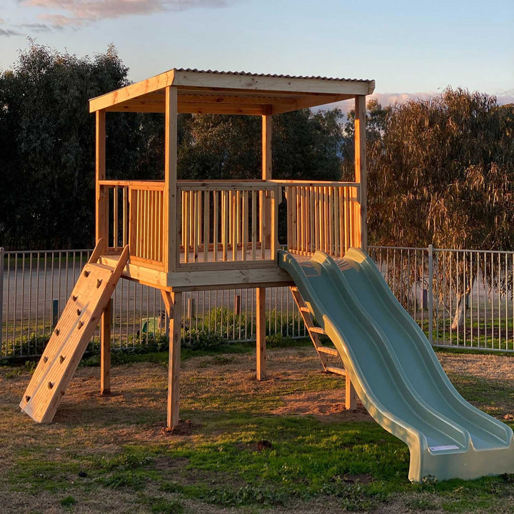 Raised platform cubby house with ladder and slides