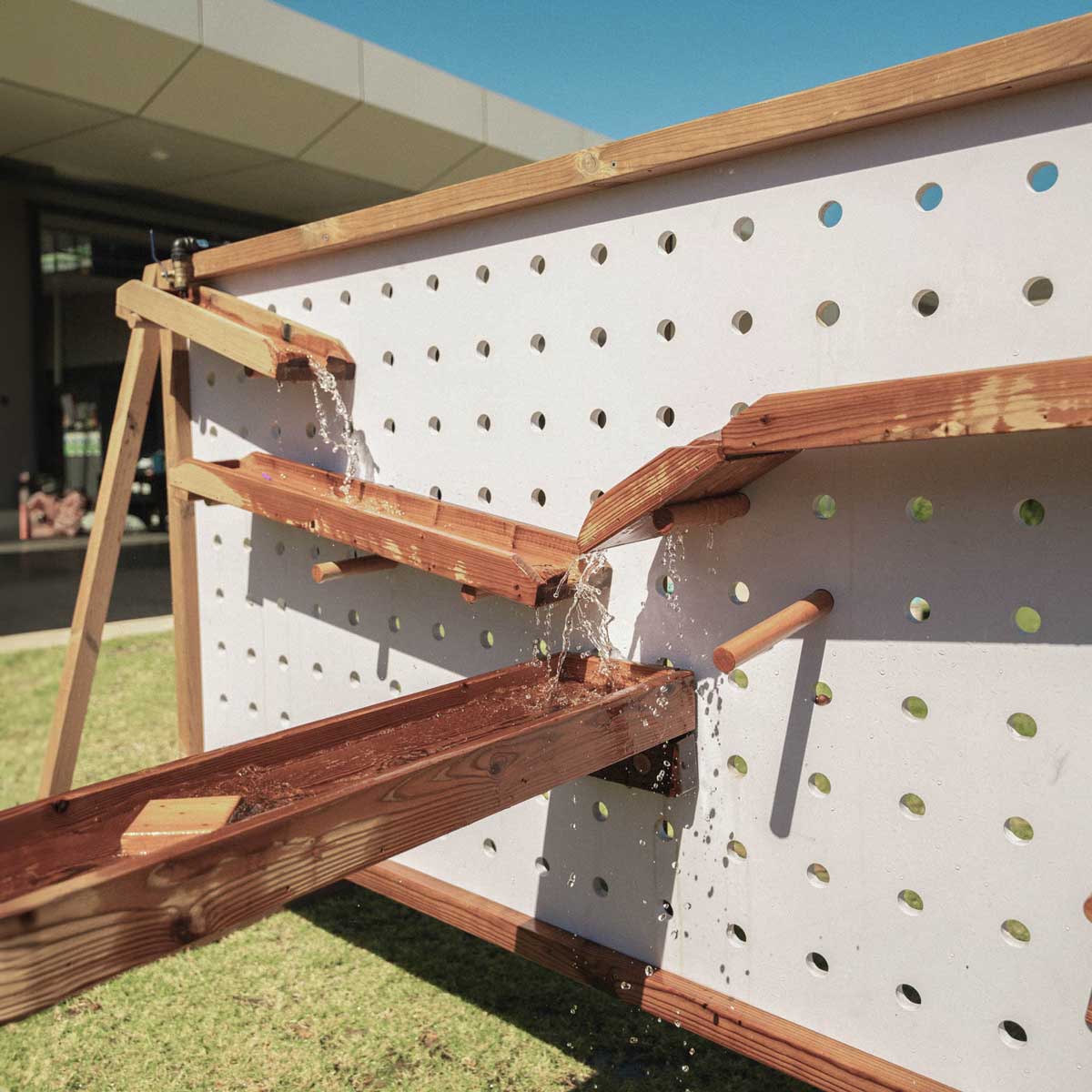 Kids Timber Outdoor Water Wall. Designed for teaching kids about cause and effect, motion, maths and other play-based learning skills, while having a bit of fun at the same time.