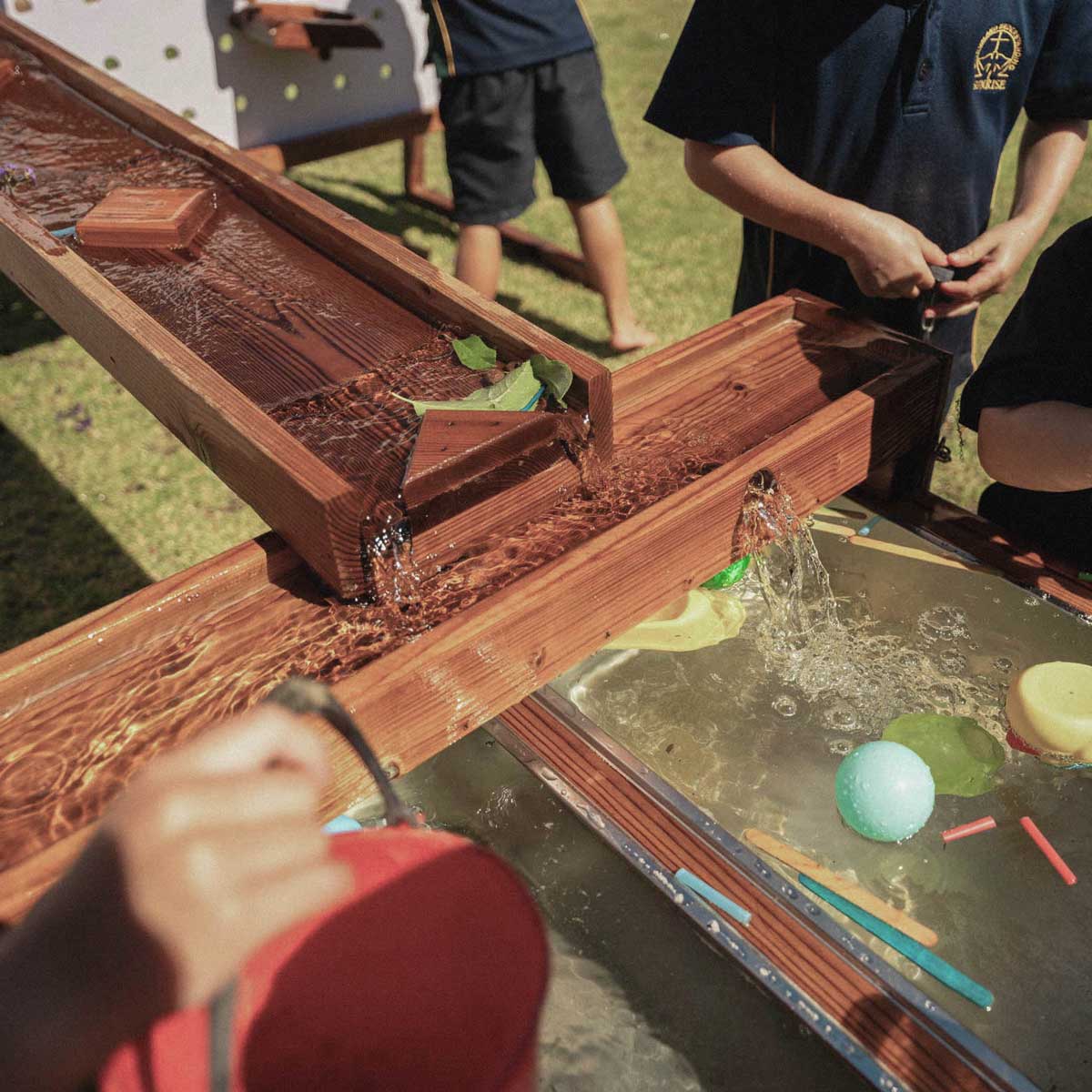 Kids Timber Outdoor Water Wall. Designed for teaching kids about cause and effect, motion, maths and other play-based learning skills, while having a bit of fun at the same time.