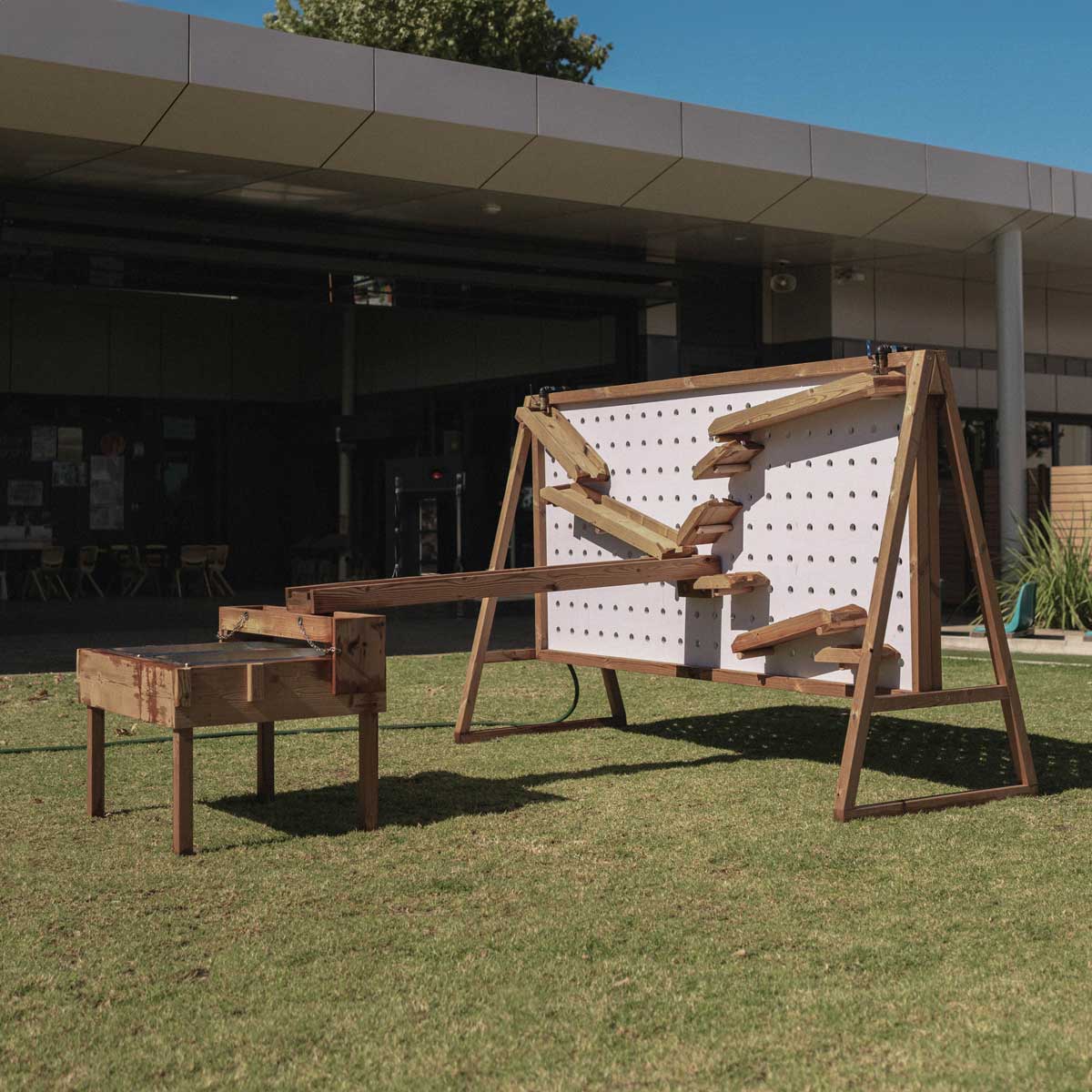Kids Timber Outdoor Water Wall. Designed for teaching kids about cause and effect, motion, maths and other play-based learning skills, while having a bit of fun at the same time.